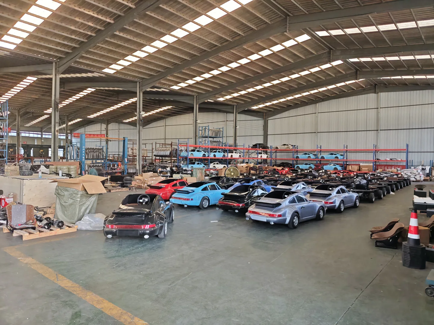 factory overview showing junior vehicles in the workshop